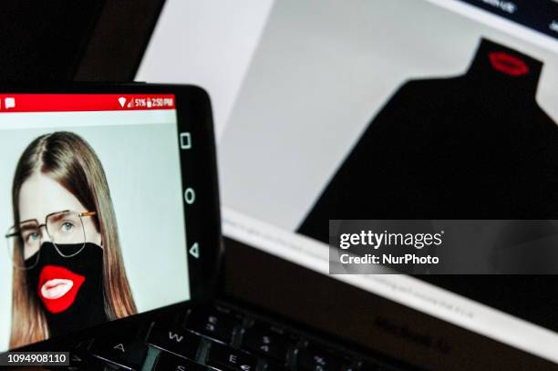 In this photo illustration, a model is seen on February 7, 2019 wearing a black Gucci turtleneck with red lips, which the fashion line recently...