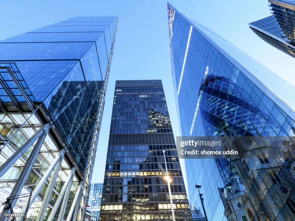 Law angle view of futuristic London skyscrapers - multiple exposure