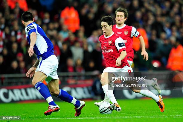 Arsenal's French midfielder Samir Nasri runs with the ball during the Carling Cup final football match between Arsenal and Birmingham at the Wembley...