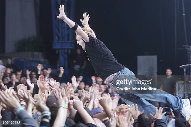 An exuberant fan takes a stage dive during the Green Day concert at Shoreline Amphitheatre on September 4, 2010 in Mountain View, California.