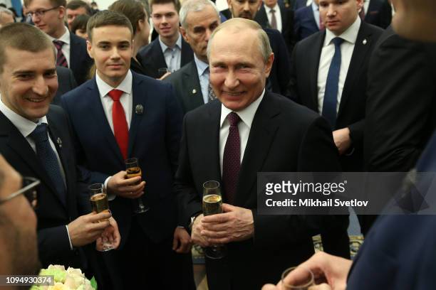 Russian President Vladimir Putin laugh during the awarding ceremony for young scientists at the Kremlin February 7, 2019 in Moscow, Russia. Russia...