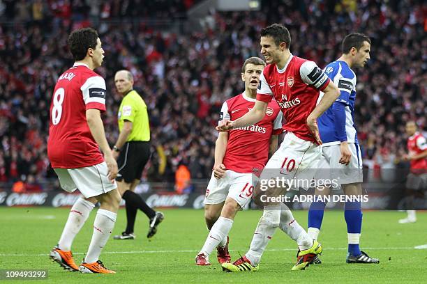 Arsenal's Dutch striker Robin Van Persie celebrates with teammates French midfielder Samir Nasri and Arsenal's English midfielder Jack Wilshere after...