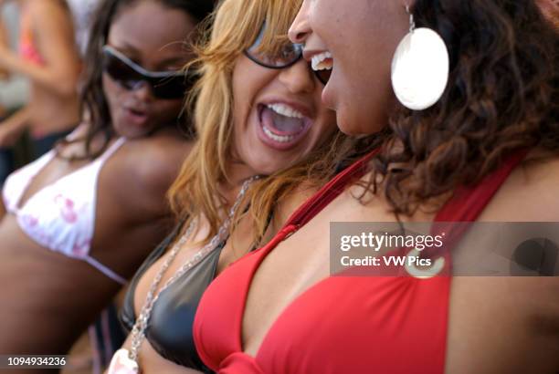 People of all ages and type dancing non stop during the day at popular club Bora Bora, in Playa d'en Bossa, Ibiza, Spain.