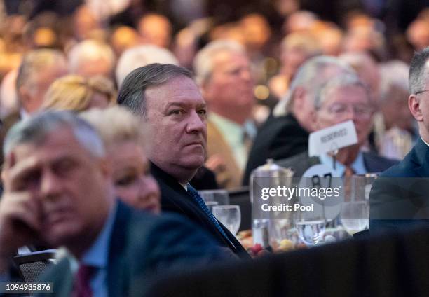 United States Secretary of State Mike Pompeo watches as U.S President Donald Trump speaks during the 2019 National Prayer Breakfast on February 7,...