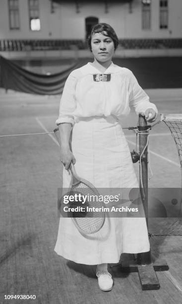 Portrait of Norwegian-born American tennis player Anna Margrethe 'Molla' Bjurstedt as she poses on the court during the Women's National Indoor...