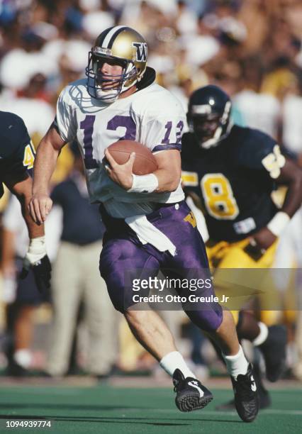 Billy Joe Hobert,Quarterback for the University of Washington Huskies runs the ball during the NCAA Pac-10 Conference college football game against...