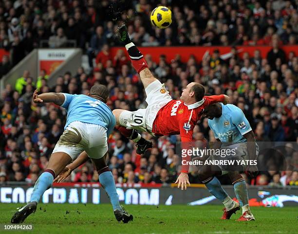 Manchester United's English striker Wayne Rooney scores their second goal during the English Premier League football match between Manchester United...