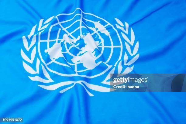 close up of united flags - united nations flag stock pictures, royalty-free photos & images