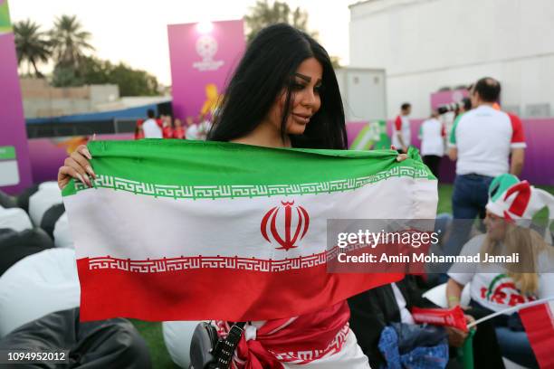 Iranian fan holds a flag during the AFC Asian Cup Group D match between Iran and Iraq at Al Maktoum Stadium on January 16, 2019 in Dubai, United Arab...