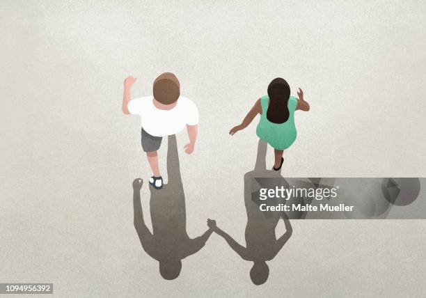 view from above shadow of couple holding hands - couple relationship difficulties stock illustrations