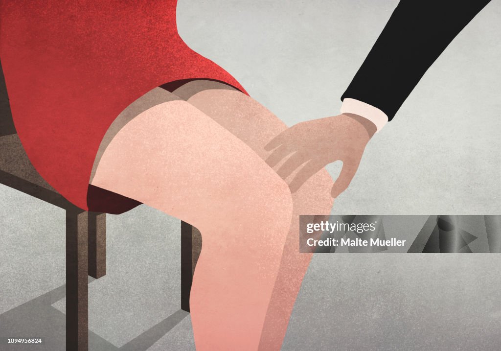 Businessman touching womans knee