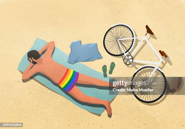 ilustrações, clipart, desenhos animados e ícones de man in rainbow swim trunks sunbathing on beach towel - sandal