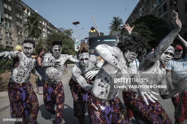 Performers parade through the street to kick off the 16th International African music festival "Sauti za Busara in Stone town on Tanzanias...