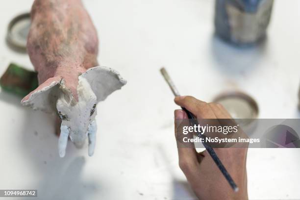 female hands painting on ceramic works - art studio stock pictures, royalty-free photos & images