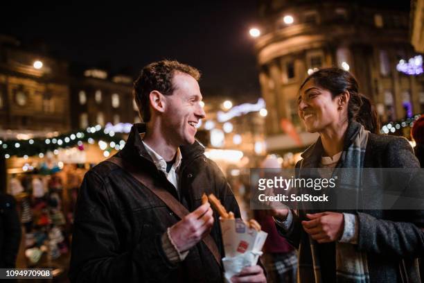 warmth of a winter market - christmas market uk stock pictures, royalty-free photos & images