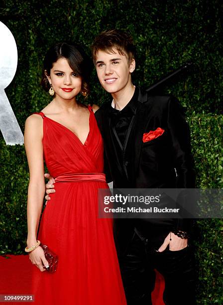 Singer-actress Selena Gomez and singer Justin Bieber arrive at the Vanity Fair Oscar party hosted by Graydon Carter held at Sunset Tower on February...