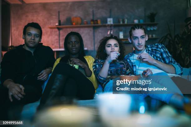 friends watching movie - watching tv couple night stock pictures, royalty-free photos & images