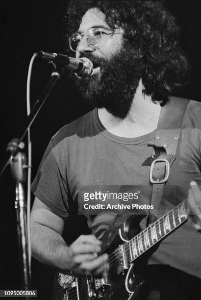 Singer and guitarist Jerry Garcia performing with American rock group The Grateful Dead, at the Woodstock Music Festival, Bethel, New York, 16th...