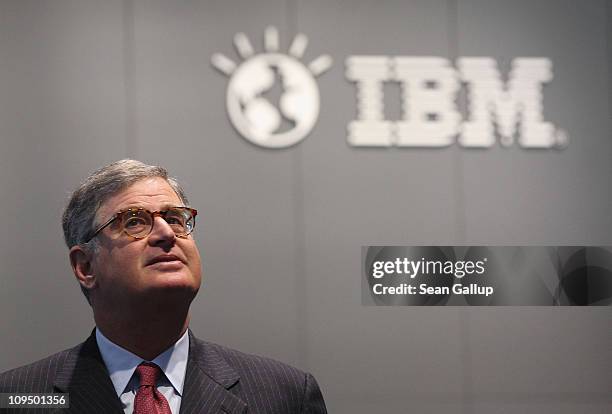 Samuel Palmisano, President and CEO of IBM, walks by an IBM logo as he tours the IBM stand at the CeBIT technology trade fair on February 28, 2011 in...