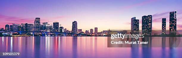 illuminated cityscape - miami skyline stock-fotos und bilder