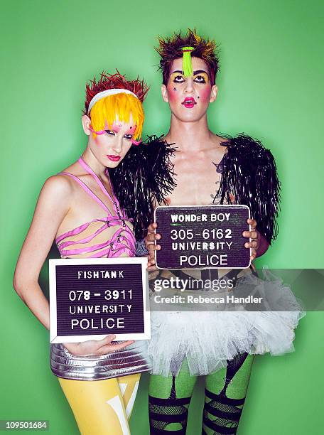 mugshot of two young people in costumes - 肩章 個照片及圖片檔