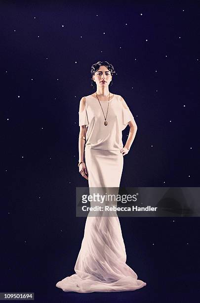 statuesque woman in long dress - evening gown stock-fotos und bilder