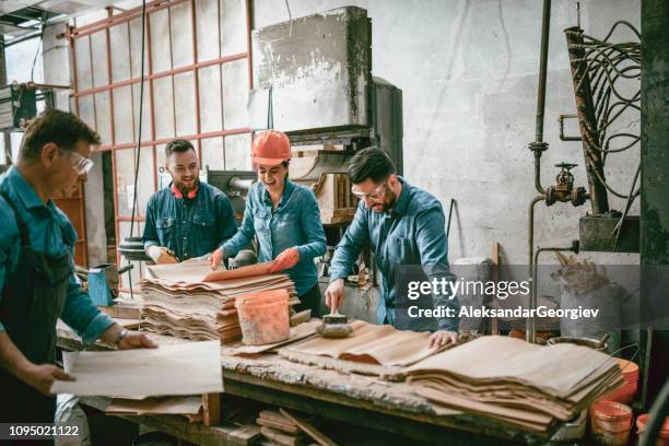 glue team in action - blue collar family stock pictures, royalty-free photos & images