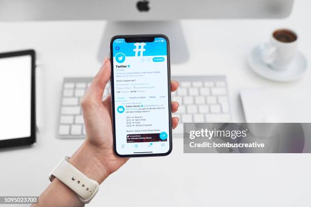 twitter profile on apple iphone x - looking at iphone x stock pictures, royalty-free photos & images