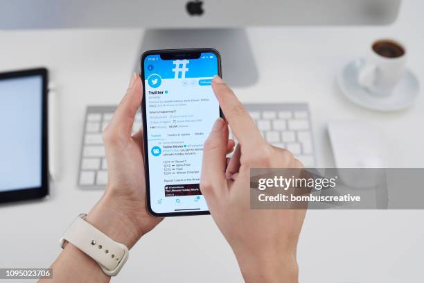 twitter profile on apple iphone x - looking at iphone x stock pictures, royalty-free photos & images