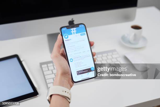 twitter profile on apple iphone x - looking at iphone x stock pictures, royalty-free photos & images
