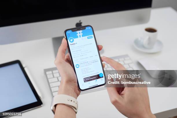 twitter profile on apple iphone x - looking at iphone x stock pictures, royalty-free photos & images