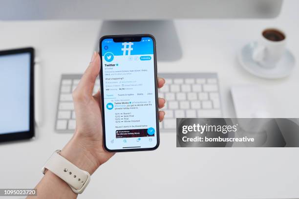 twitter profile on apple iphone x - looking at iphone x stock pictures, royalty-free photos & images