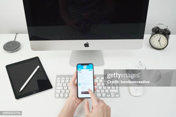 twitter profile on apple iphone x - looking at iphone x stock pictures, royalty-free photos & images