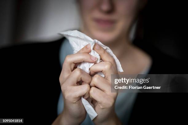 In this photo illustration a female person blows her nose on February 05, 2019 in Berlin, Germany.