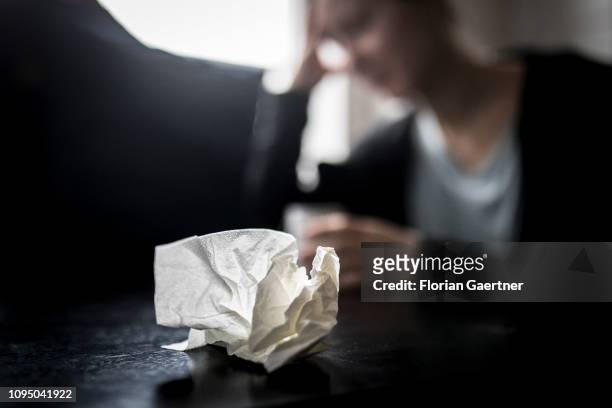 In this photo illustration a handkerchief is pictured in front of a sich woman on February 05, 2019 in Berlin, Germany.