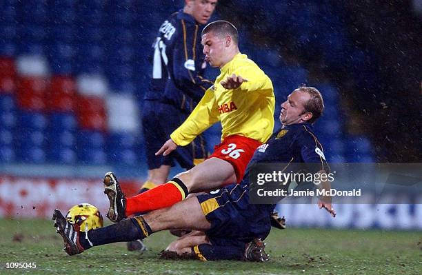 Jamie Hand of Watford is tackled by Hakan Mild of Wimbledon during the Nationwide Division One game between Wimbledon and Watford at Selhurst Park,...