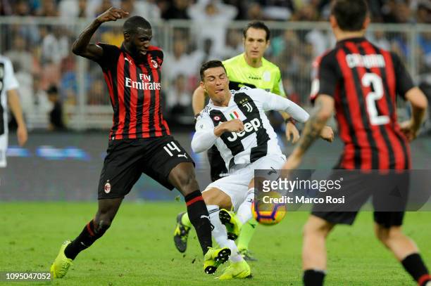 Cristiano Ronaldo of Juventus is tackled by Tiemoue Bakayoko of AC Milan during the Italian Supercup match between Juventus and AC Milan at King...