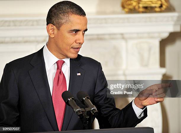 President Barack Obama makes a point as he and Vice President Joe Biden host a meeting with a bipartisan group of governors in the State Dining Room...