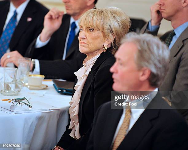 Governor Jan Brewer listens as U.S. President Barack Obama makes remarks during a meeting with a bipartisan group of governors hosted by the...