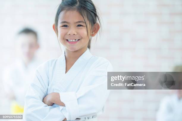 martial arts girl - girl martial arts stock pictures, royalty-free photos & images