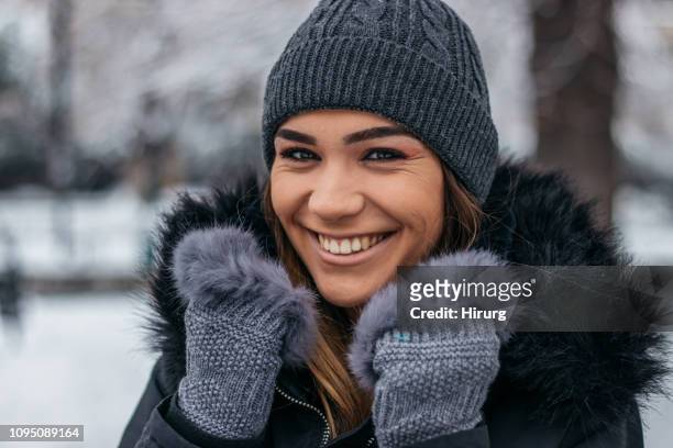 beautiful woman smiling - fur glove stock pictures, royalty-free photos & images