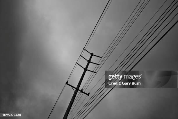 utility pole and cables - blackout stock pictures, royalty-free photos & images