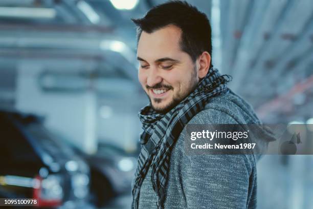 handsome man on a parking at night - man business hipster dark smile stock pictures, royalty-free photos & images