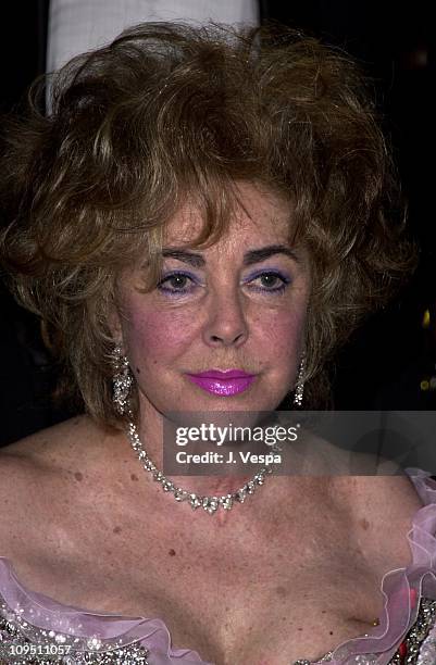 Elizabeth Taylor wearing Chandelier Diamond earrings by William Goldberg with a Chopard Diamond Necklace and Butterfly broach at A Diamond is Forever...