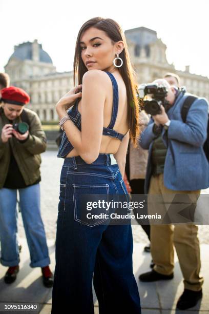 Madison Beer, wearing a denim crop top and denim blue jeans, is seen in the streets of Paris after the Off-White show on January 16, 2019 in Paris,...