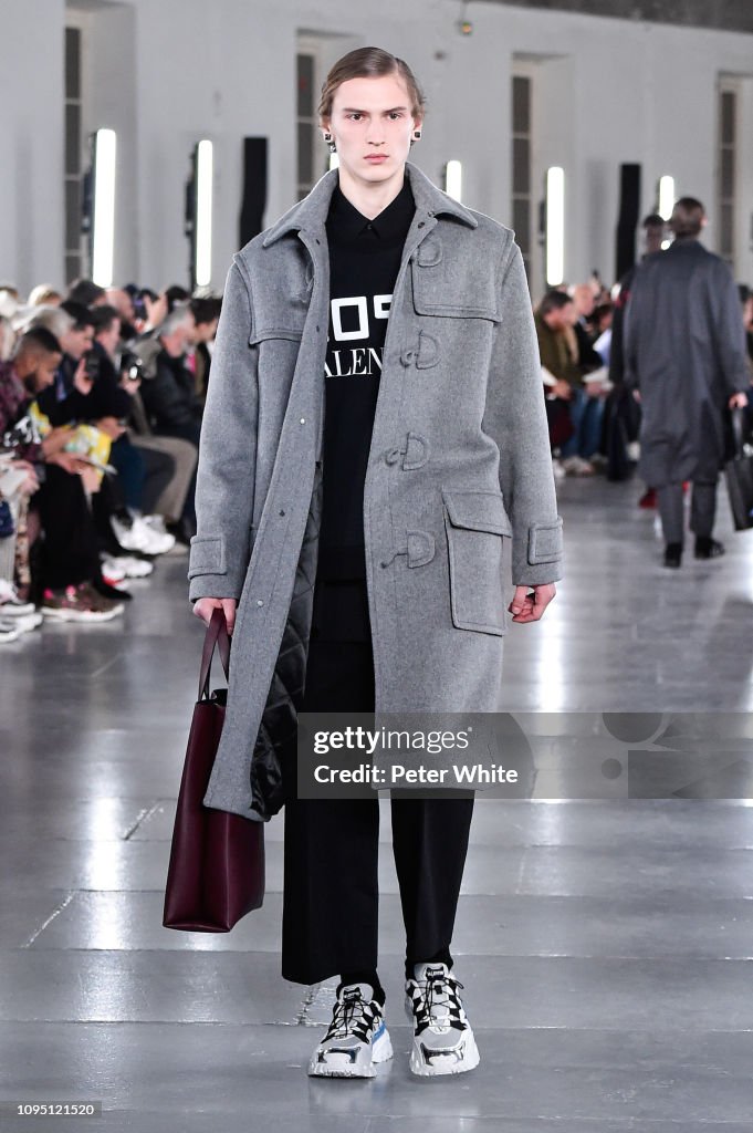 A model walks the runway during Valentino Menswear Fall/Winter... News ...