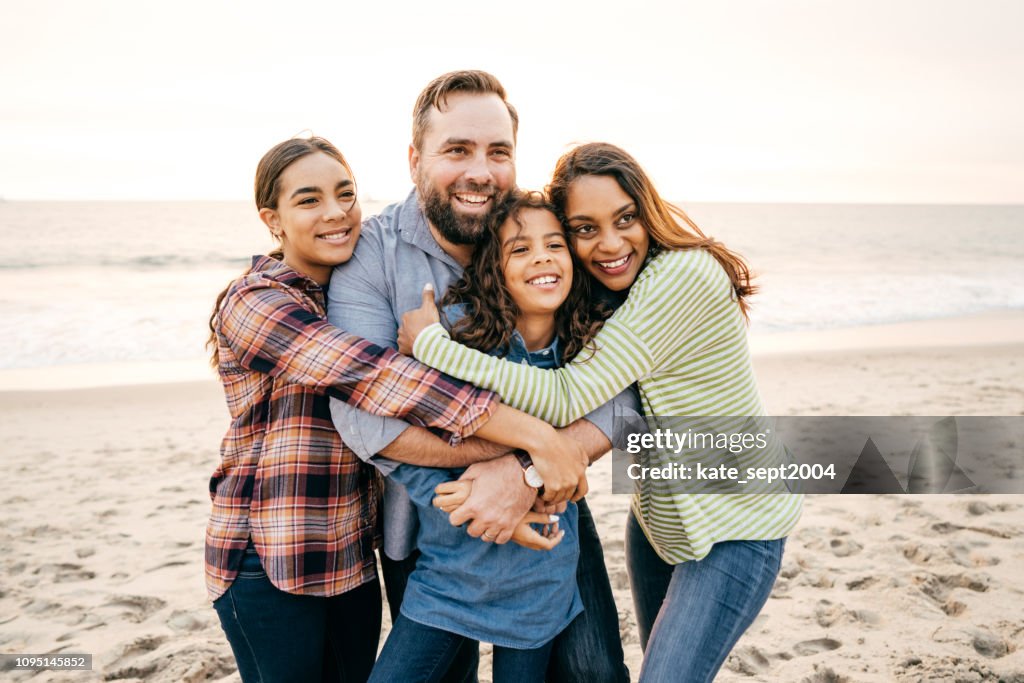 Happy family with two teen kids