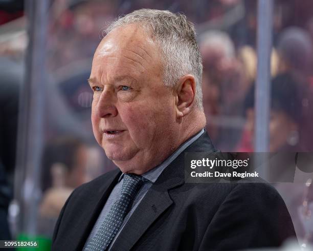 Head coach Randy Carlyle of the Anaheim Ducks watches the action from the bench against the Detroit Red Wings during an NHL game at Little Caesars...