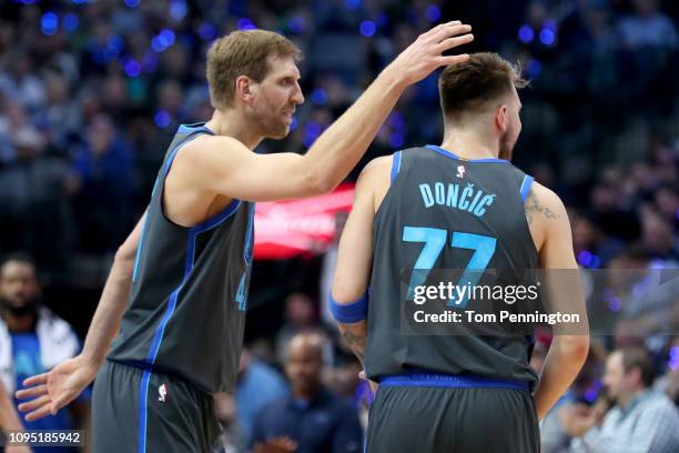 Dirk Nowitzki of the Dallas Mavericks celebrates with Luka Doncic of the Dallas Mavericks in the first half at American Airlines Center on January...