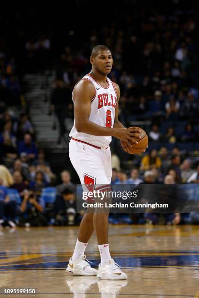 Cristiano Felicio of the Chicago Bulls looks to pass the ball against the Golden State Warriors at ORACLE Arena on January 11, 2019 in Oakland,...